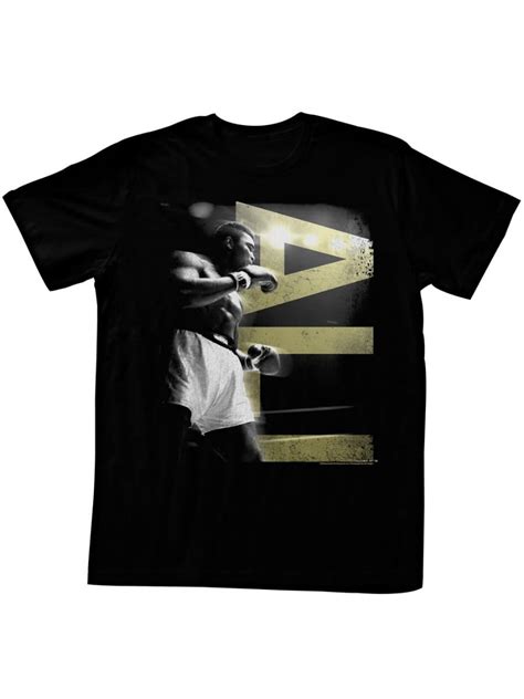 Muhammad Ali in A Boxing Stance with Ali in Gold Letters Black 